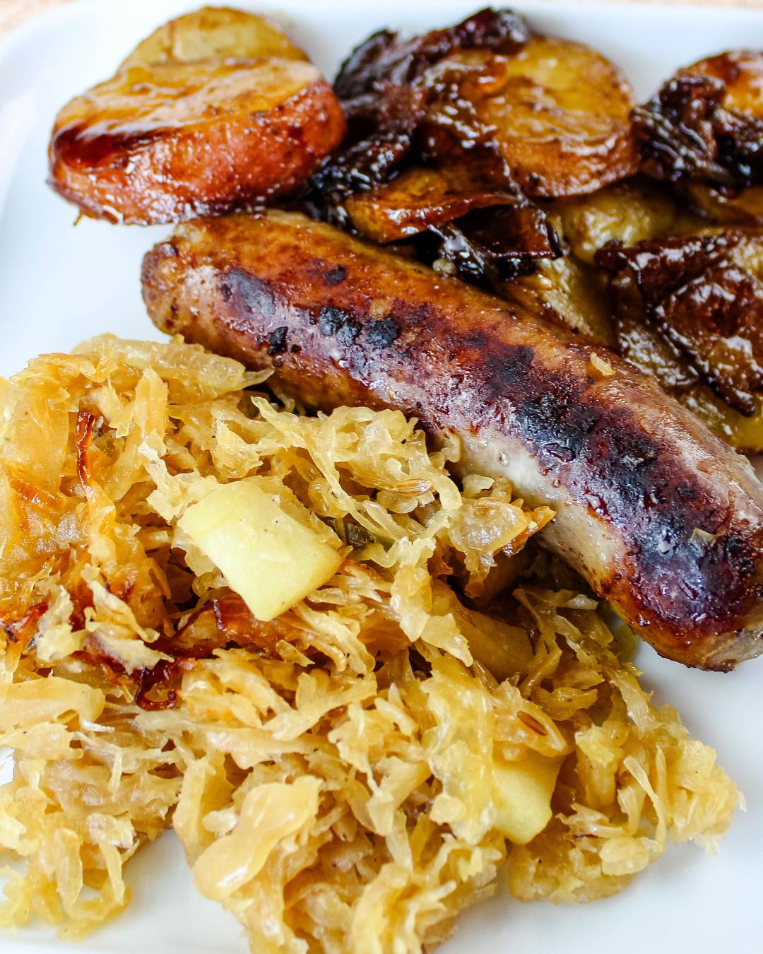 Flavorful German Sauerkraut with Bratwurst, crispy Bacon, and caramelized Onions for a hearty dish.