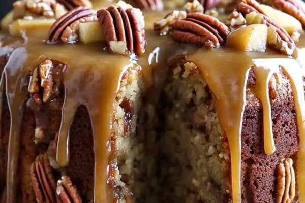 Apple pecan cake with a moist texture, crunchy pecans, and a rich caramel glaze