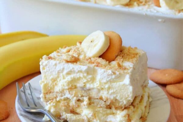 Creamy banana cream cheesecake with a rich texture, graham cracker crust, and whipped topping.