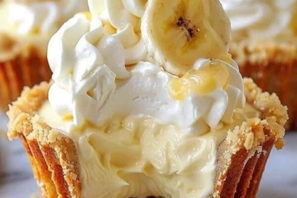 Delicious banana cream pie cupcakes with a fluffy texture, creamy filling, and a golden crust.