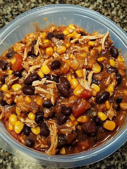 My favorite quick easy meal. 2 cans of chicken, 1 can of black beans, 1 can of corn and taco seasoning.