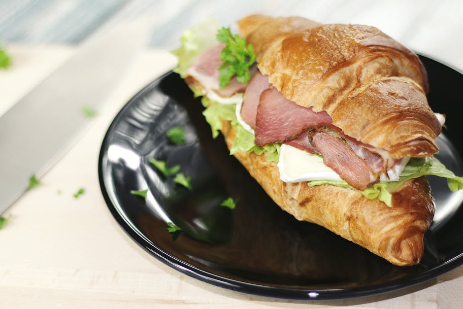 classic philly cheese steak sandwich ingredients in a sandwich roll